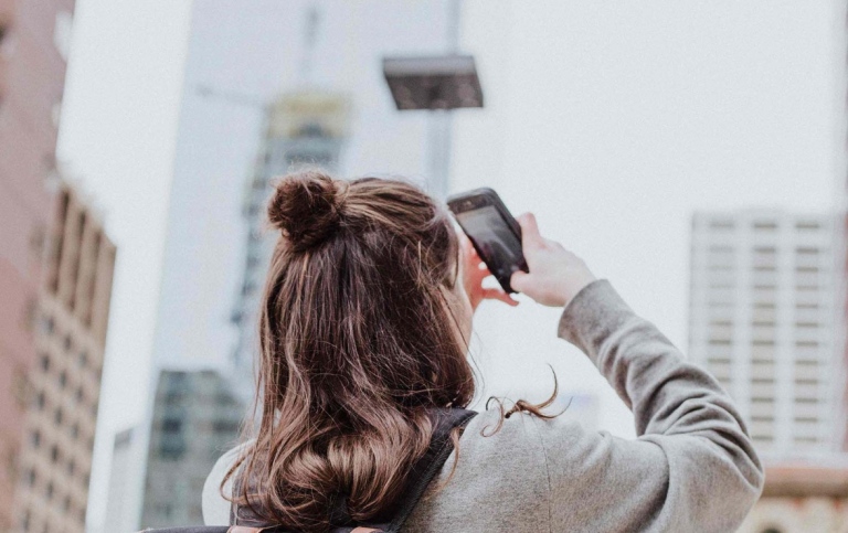 Female student taking photographs