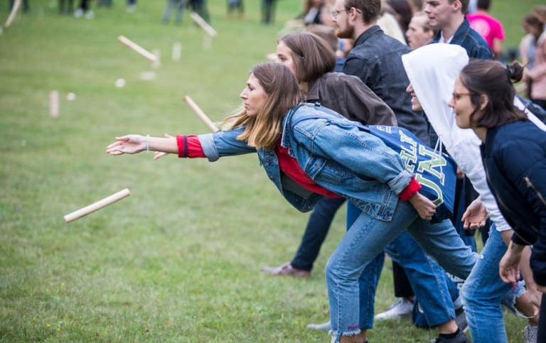 Students playing a lawn game on campus.