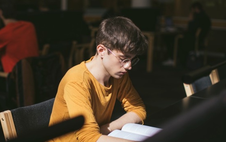 A student studying in the library. Photo: Niklas Björling