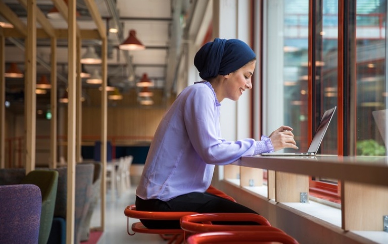 Female student working with computer. Photo: Niklas Björling