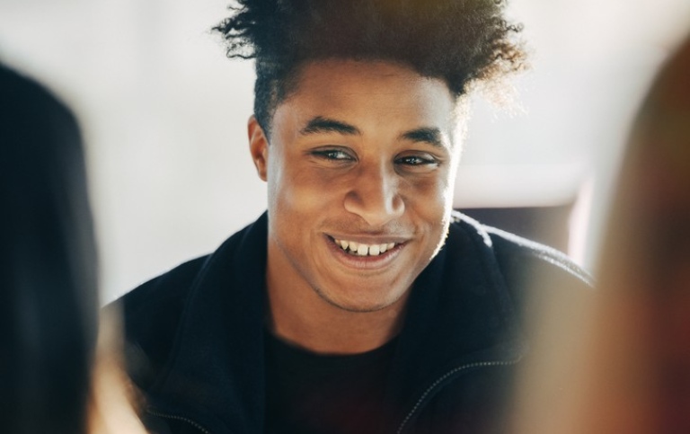 Male student smiling. Photo: Niklas Björling