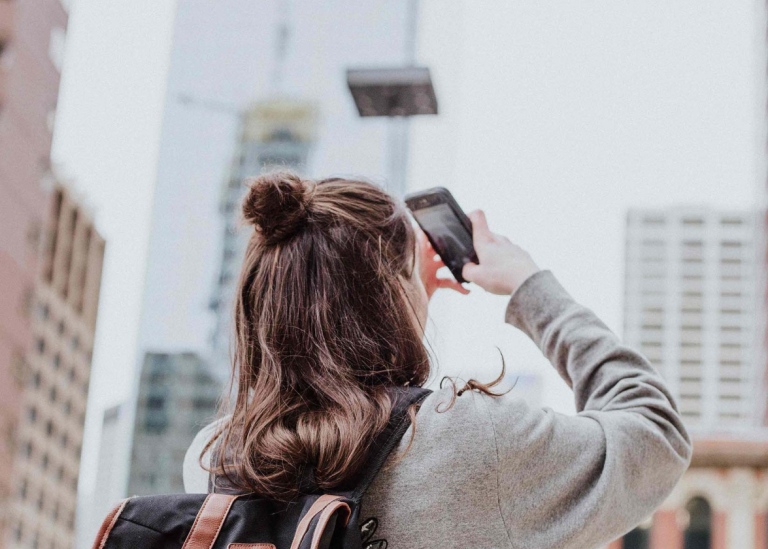 Female student taking photographs