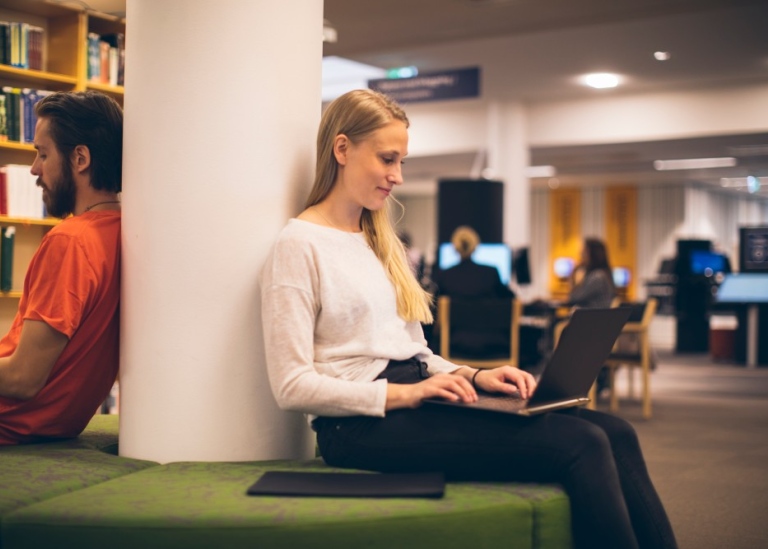 Two students in the library.