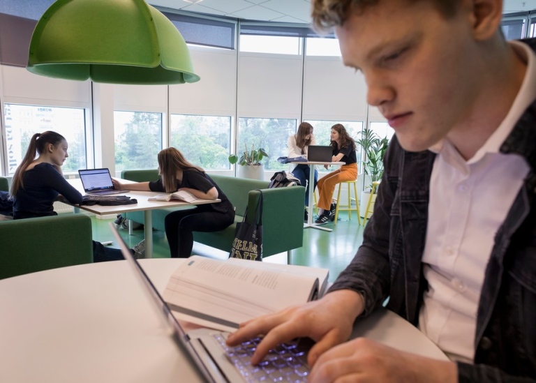 A student in front of his laptop.