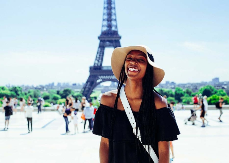 Student in front of Eiffel tower, Paris