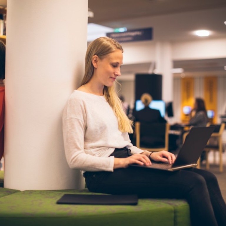 Two students in the library.